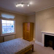 Bedroom 1 showing the fireplace